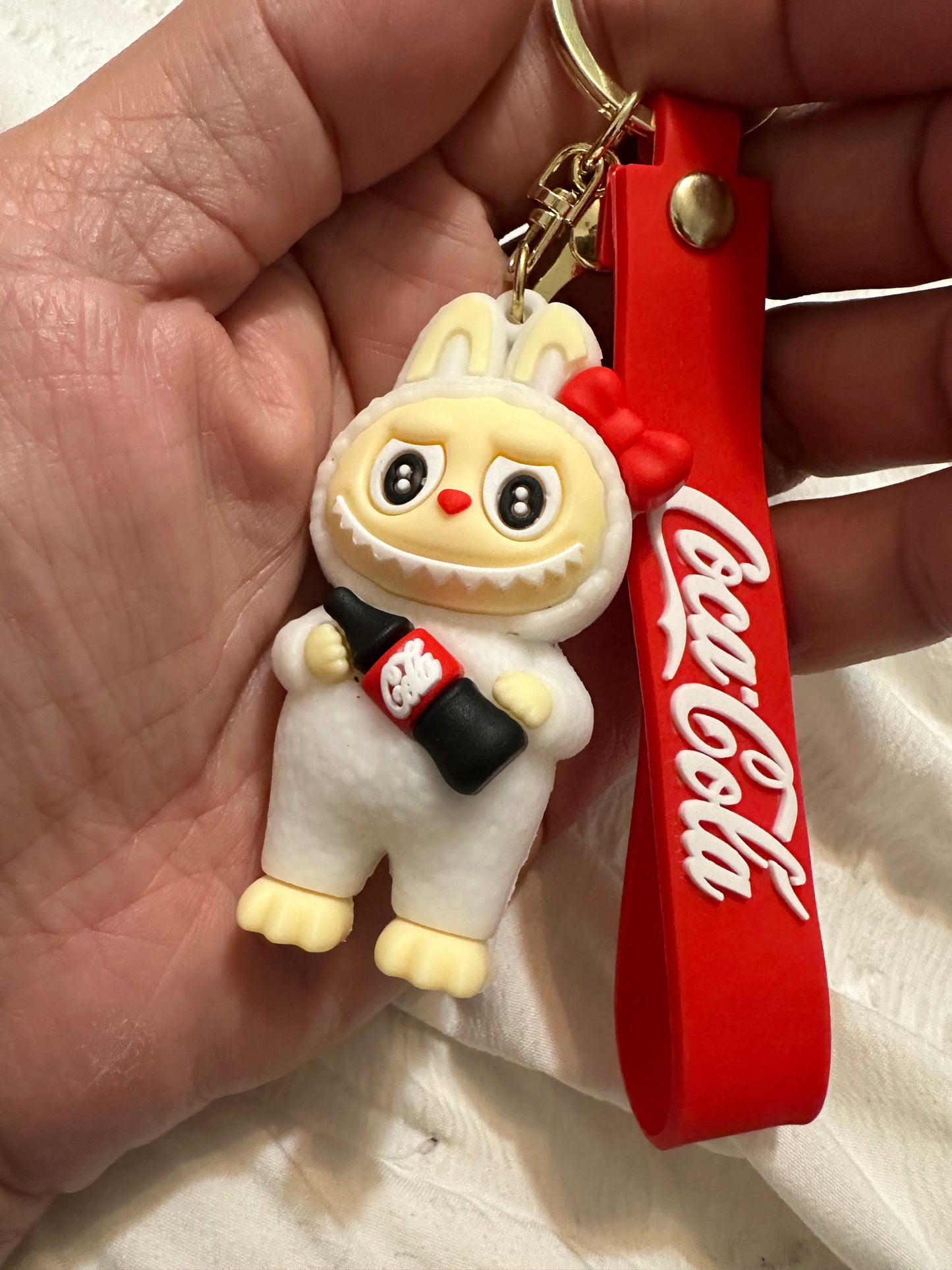 COKE key chain- Hugging the bottle