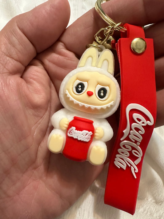 COKE key chain- Hugging a red can